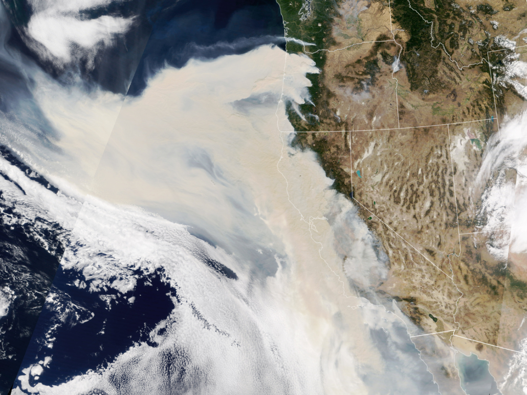 Satellite image of wildfire smoke plume blowing over the ocean from the U.S. west coast